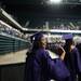 A graduate waves as she marches out into EMU's Convocation Center during the start of Pioneer's 2013 graduation ceremony, Thursday, June 6.
Courtney Sacco I AnnArbor.com 